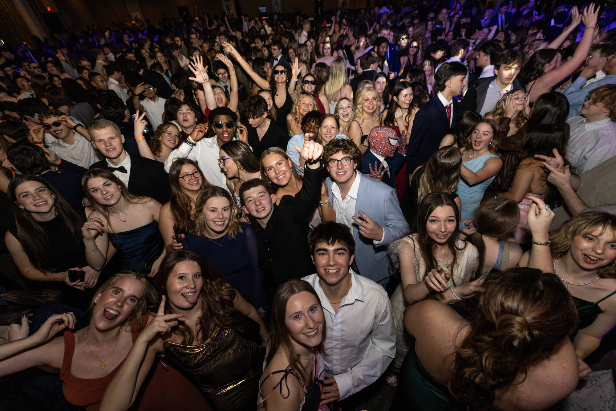 A crowd of formally-dressed students dancing at Presidents' Ball